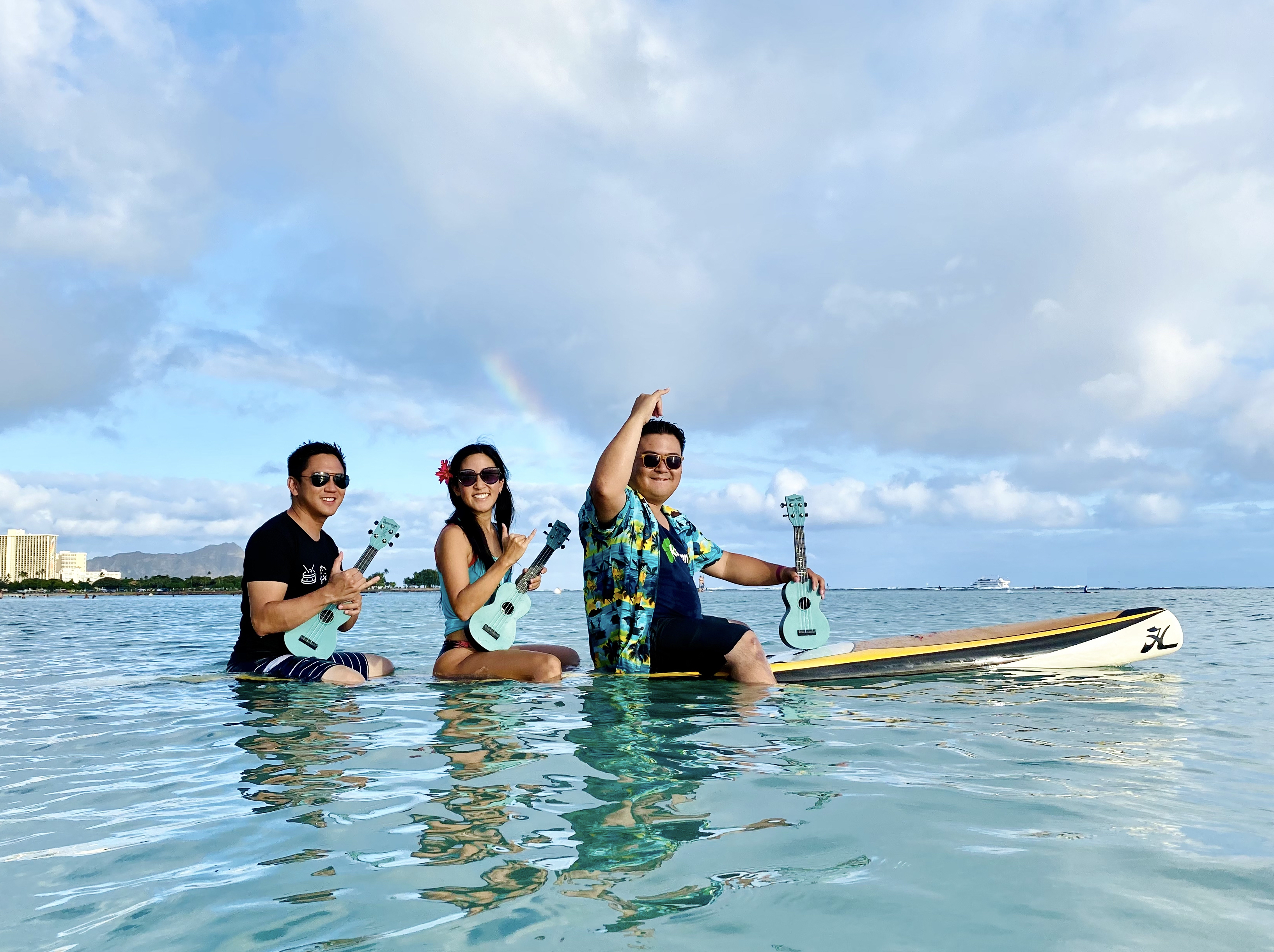 U3, Cynthia Lin, Abe Lagrimas Jr, Ukulenny rowing on the ocean in Hawaii with ukuleles